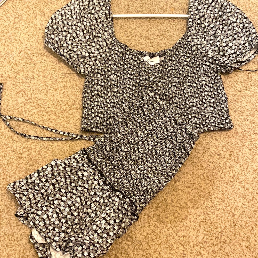 White and black set, sleeved top, matching skirt. flower printed.